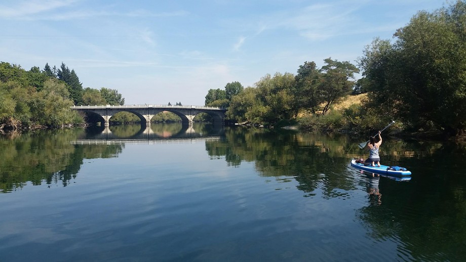 woman on stand up paddleboard in spokane, WA