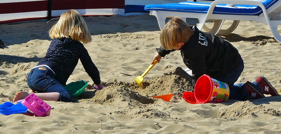 Children Sharing on Beach