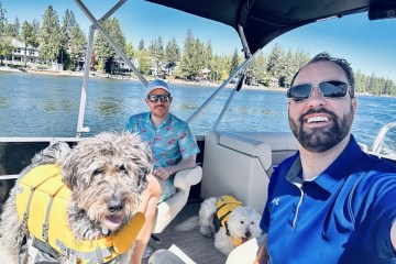 a man wearing sunglasses and a dog on a boat