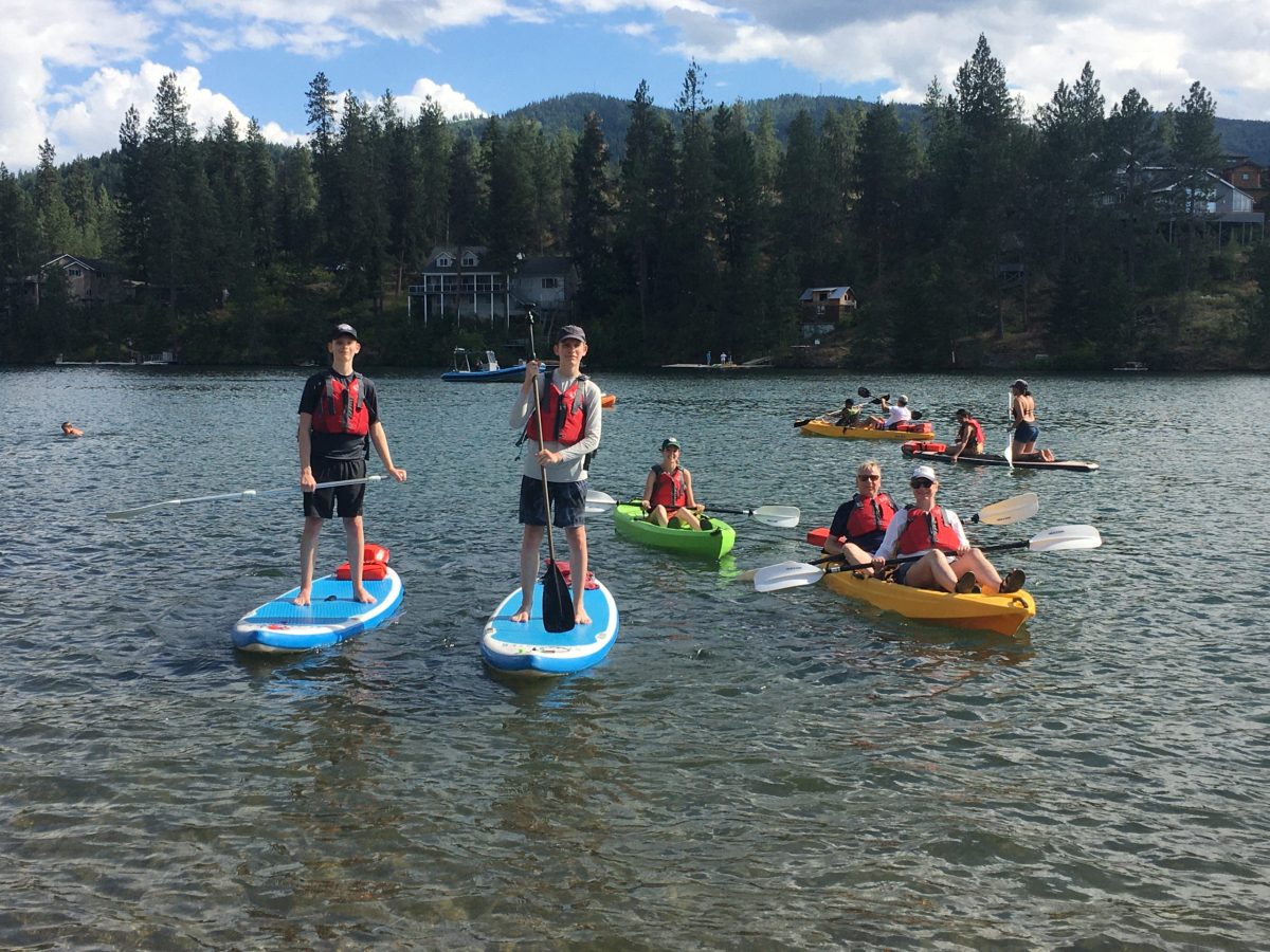 People enjoying their time on paddleboards and kayaks!